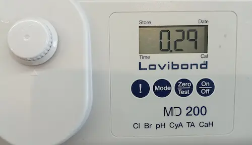 Water analysis service photometer reading a water sample for quality testing
