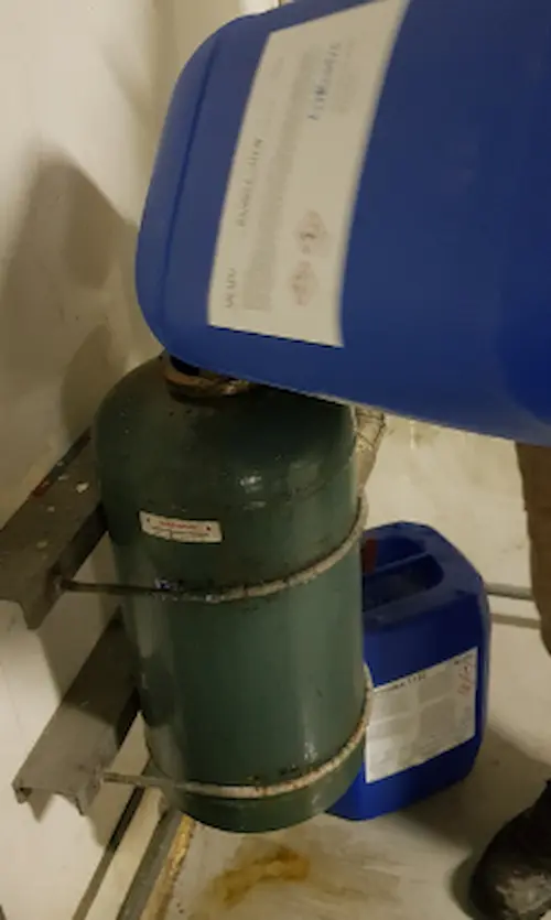 Dosing chilled water treatment chemicals into an HVAC bypass pot feeder for closed-loop corrosion control