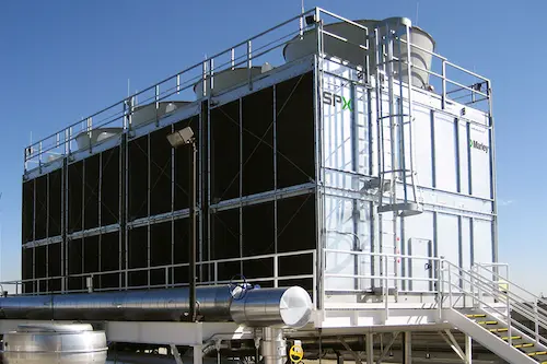 Metal cooling tower on a building rooftop