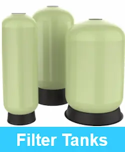 Industrial water filter vessels on display in various sizes and capacities for commercial filtration systems.