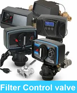 A display of different digital water filter controllers and automatic softener control valves for commercial water systems.