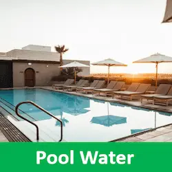 Sparkling blue swimming pool outside a modern holiday villa fo pool water treatment