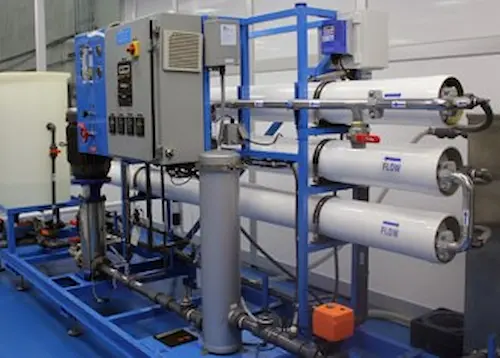 Complete industrial reverse osmosis RO system featuring a membrane vessel array, high-pressure pumps, and a centralized control panel.