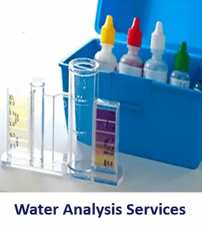 A water quality test kit laid out with small liquid reagent bottle