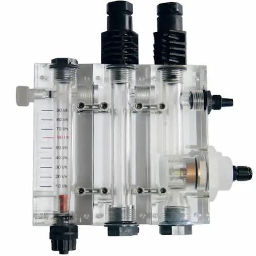 Industrial water treatment controller sensor manifold with inline pH and conductivity probes.