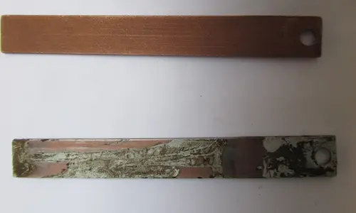 Side-by-side comparison of a new unexposed corrosion coupon and a used corroded coupon from a water treatment system